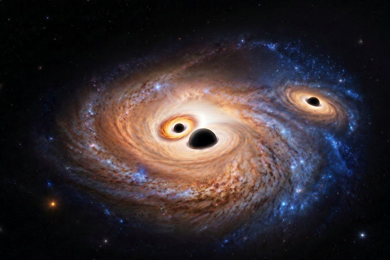 Três buracos negros supermassivos descobertos numa galáxia do Universo primitivo